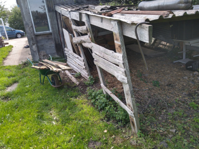 Goat Shelter sides being removed for bonfire
