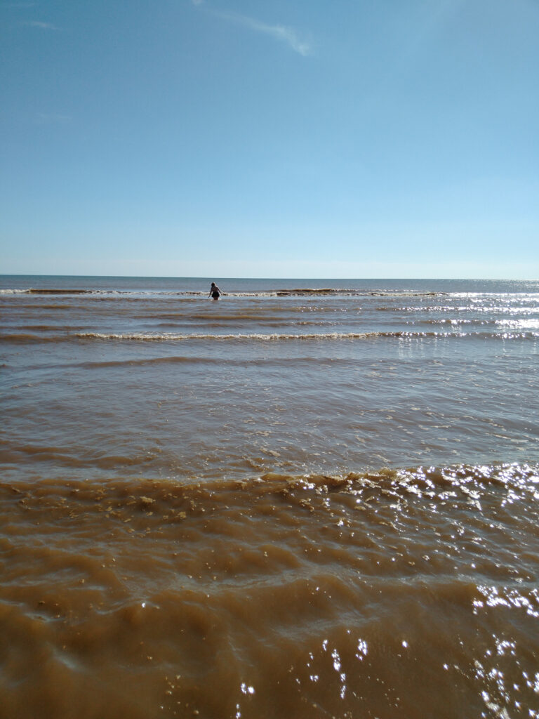 Jane trying to find water deep enough to swim in