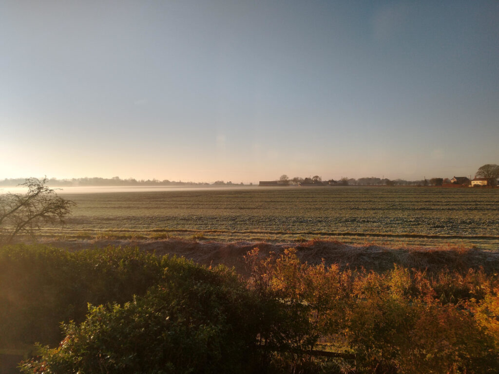 Autumn mist rolling across the field
